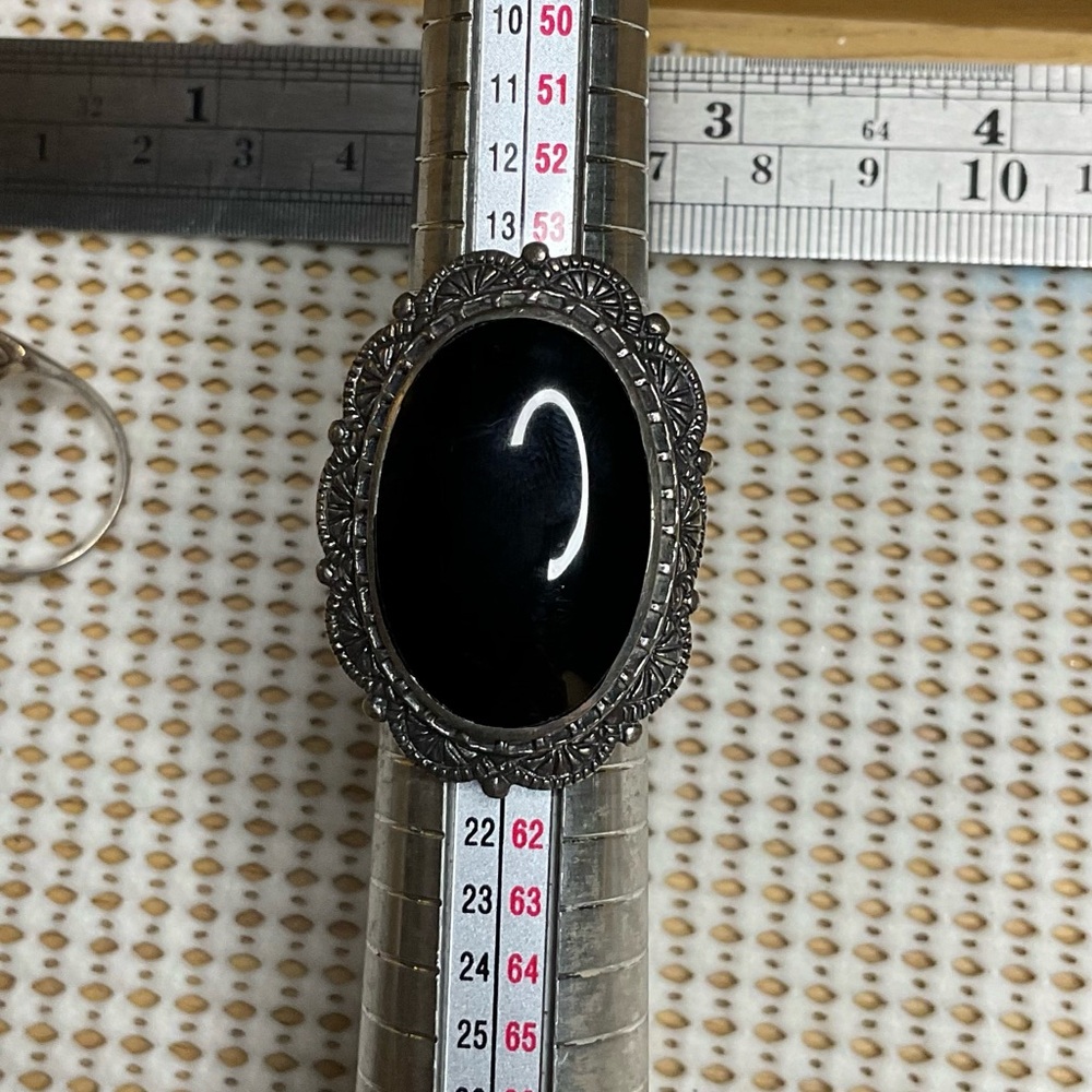 Elegant Black Oval Ring with Silver Detailing